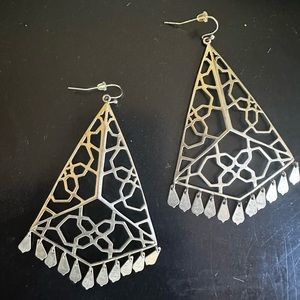 Gold Kendra Scott earrings.
